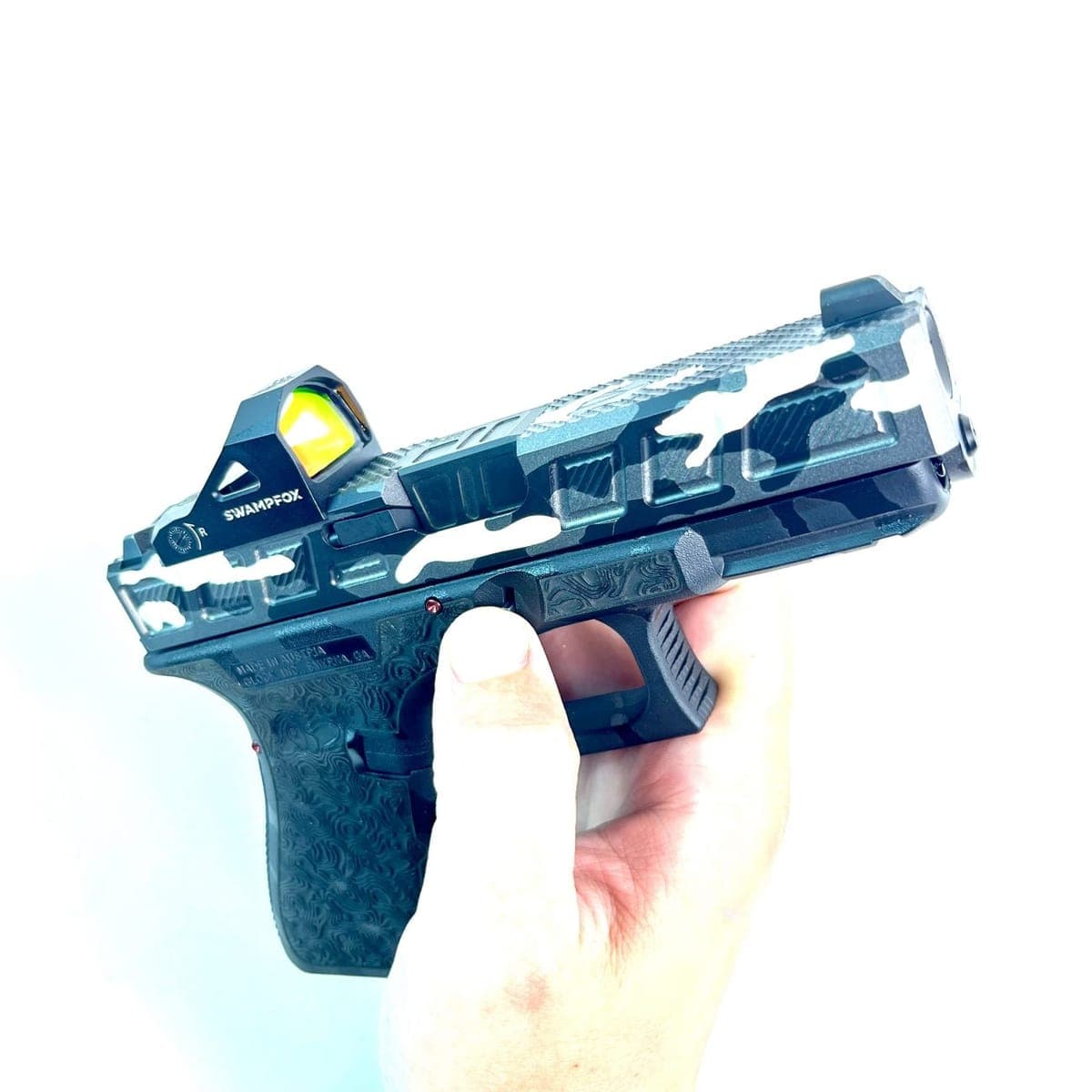 Pulling down the Glock takedown lever