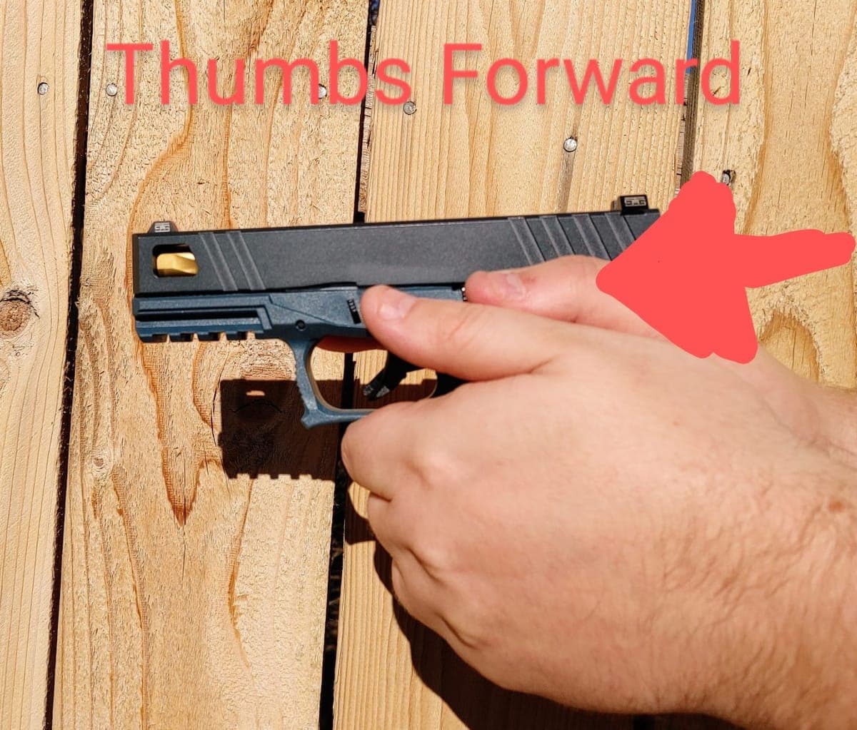 Two-handed pistol grip with thumbs clear of the slide