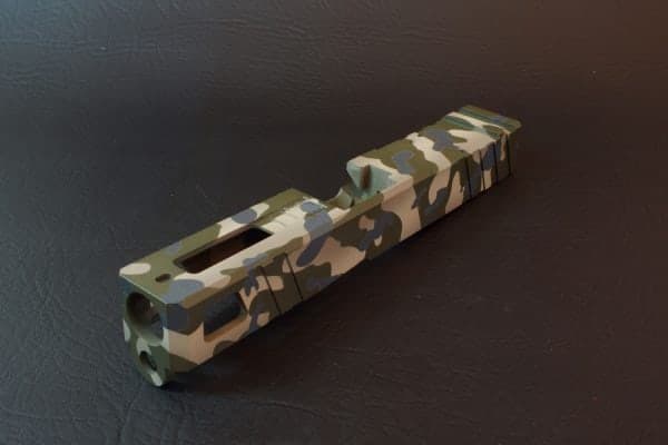 Slide in a three-colour OD green, sniper grey and sand camo