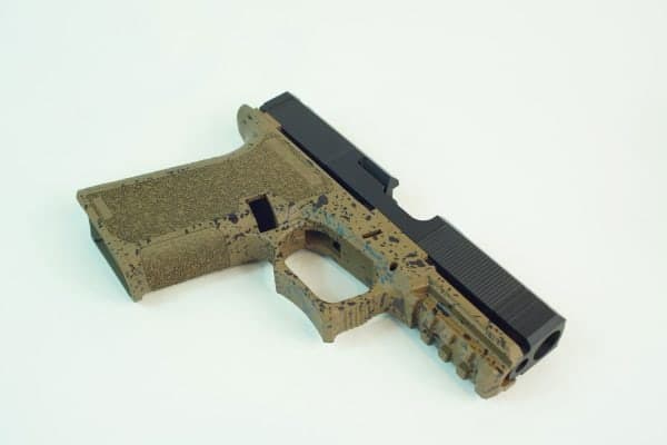 Pistol with an FDE stippled frame and graphite black slide