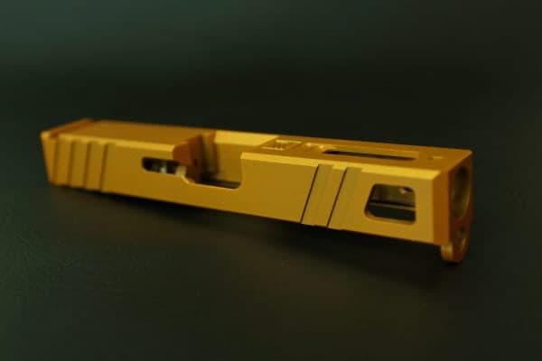 Bare slide in gold on a dark green background