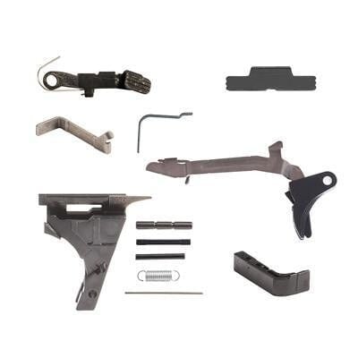 Glock 19 lower parts kit laid out on white: trigger bar, slide lock, mag release, springs and pins