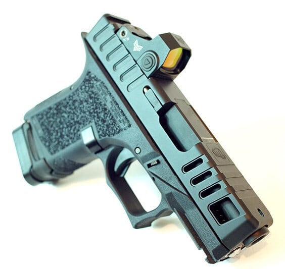 Juggernaut slide in teal with large side windows and a red dot optic, on a matching teal Glock 26 frame