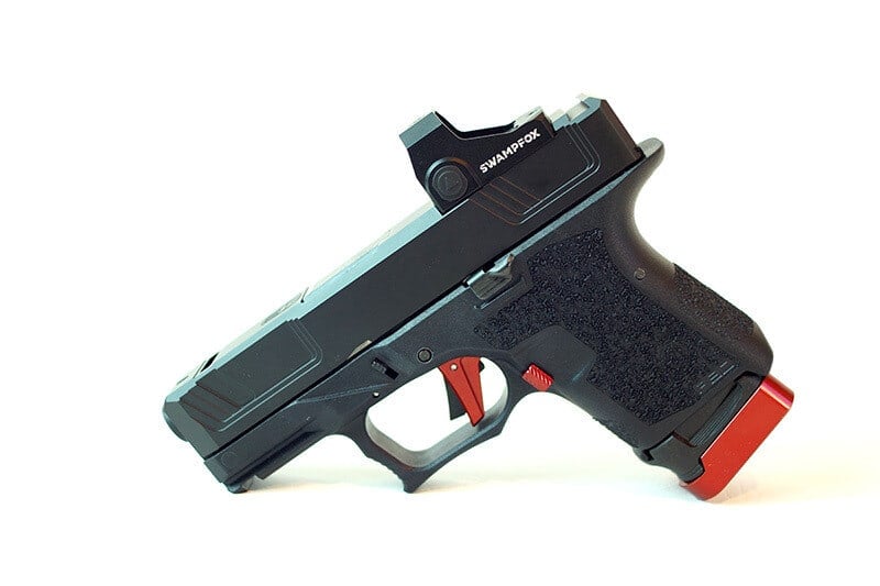 Raider slide in graphite black with a red dot optic, on a Glock 26 frame with a red magazine release