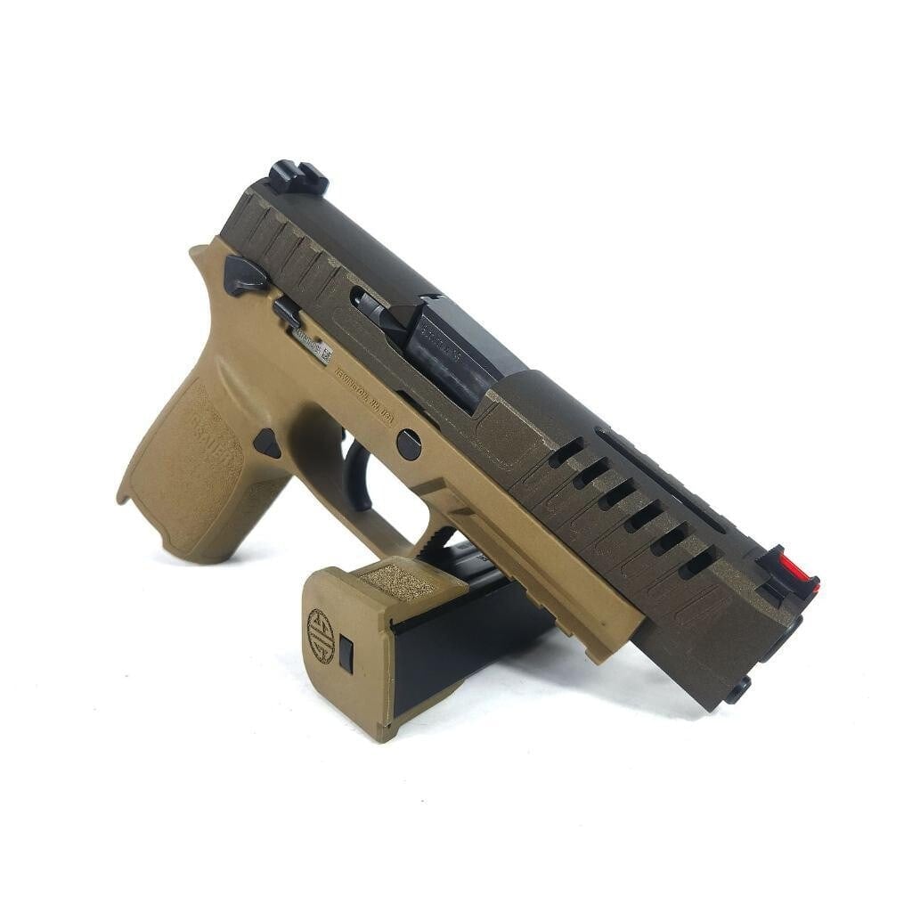 Annihilator slide in graphite black with aggressive window cuts, on an FDE P320 grip module