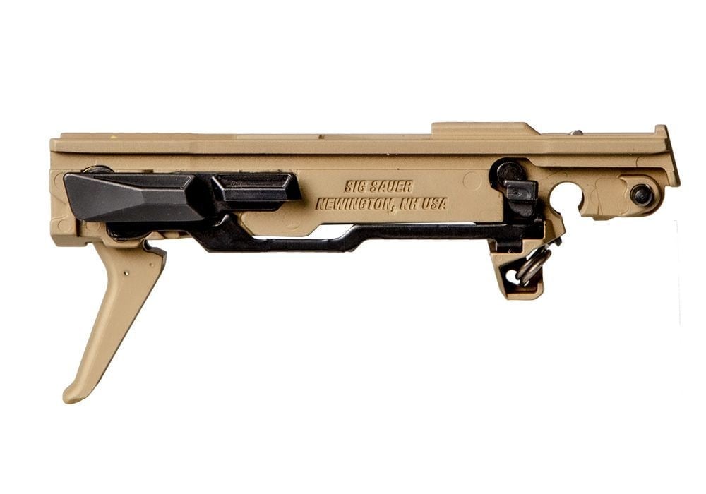 Sig Sauer P365 fire control unit in a gold finish with a flat trigger, on white